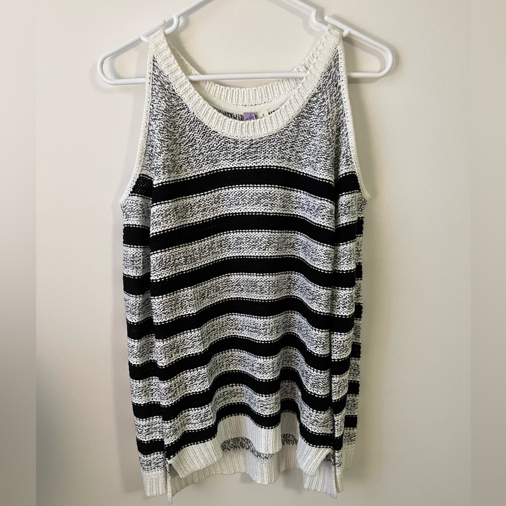 Black and white striped sweater with slits in both shoulders